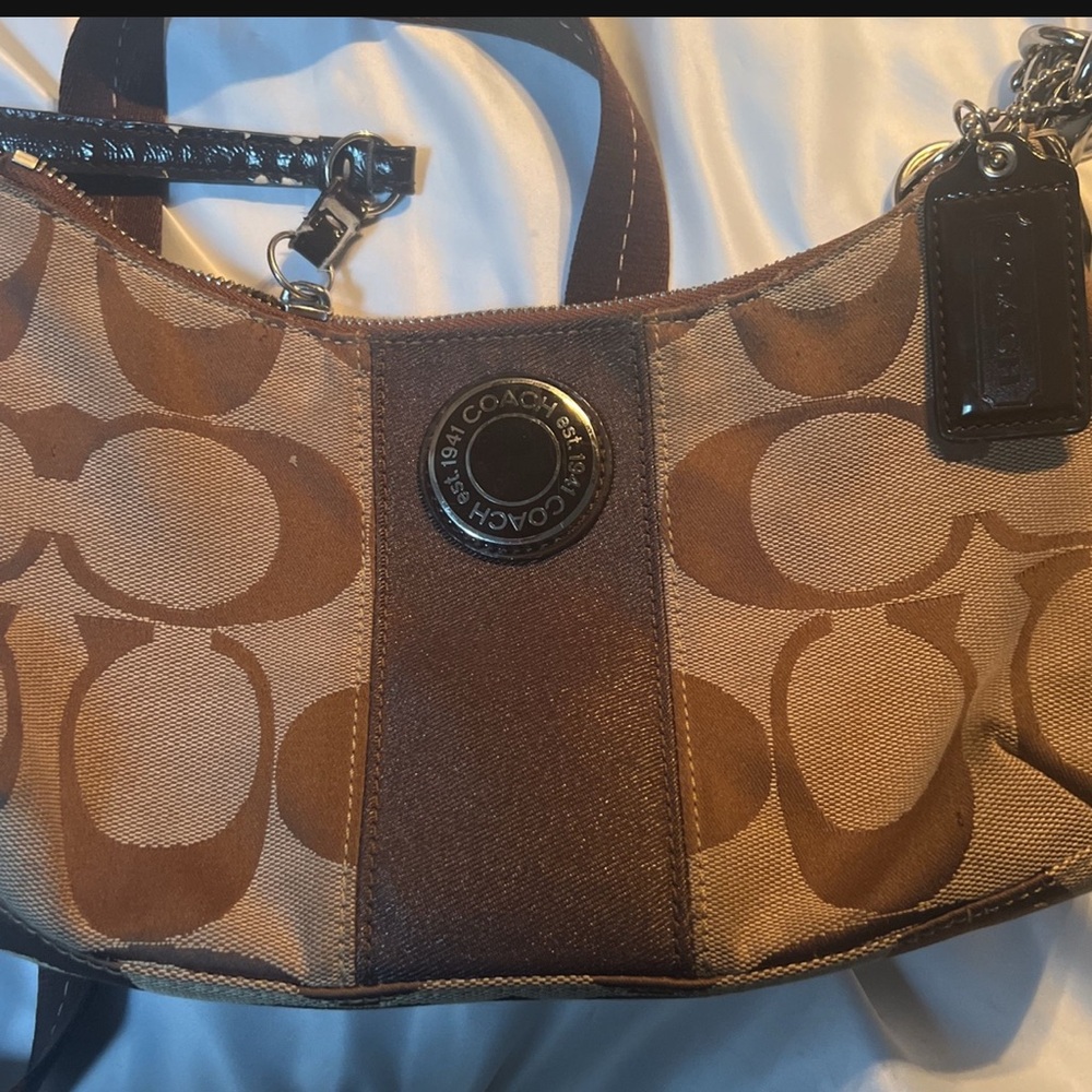 Coach Brown Shoulder Bag with Interlocking C Pattern and Curved Shape